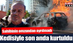 Alev topuna dönen araçtan kedisiyle birlikte son anda çıktı