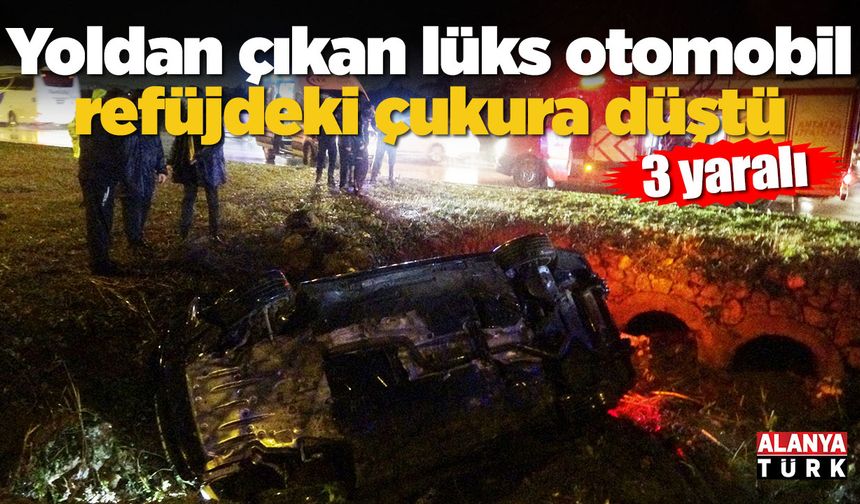 Yoldan çıkan lüks otomobil refüjdeki çukura düştü